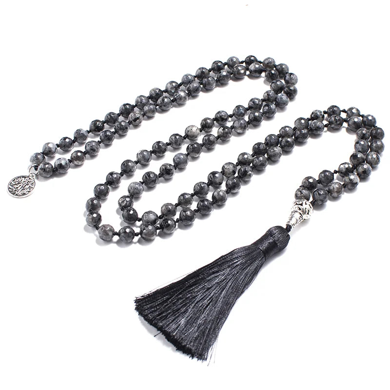 Full Labradorite tassel mala arranged on a white background.