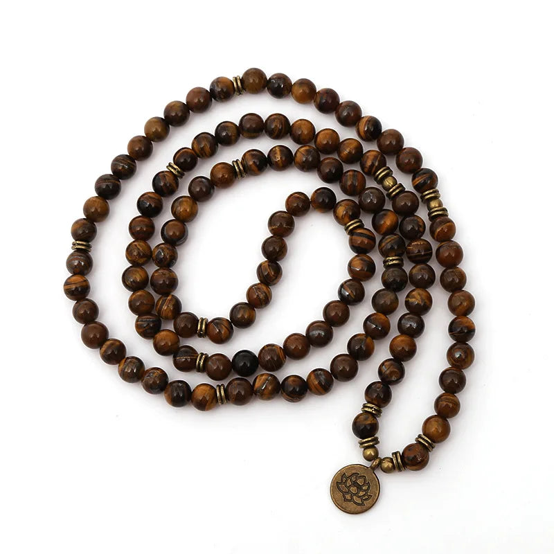 Full Tiger’s Eye mala arranged in a long loop with round lotus-style charm.