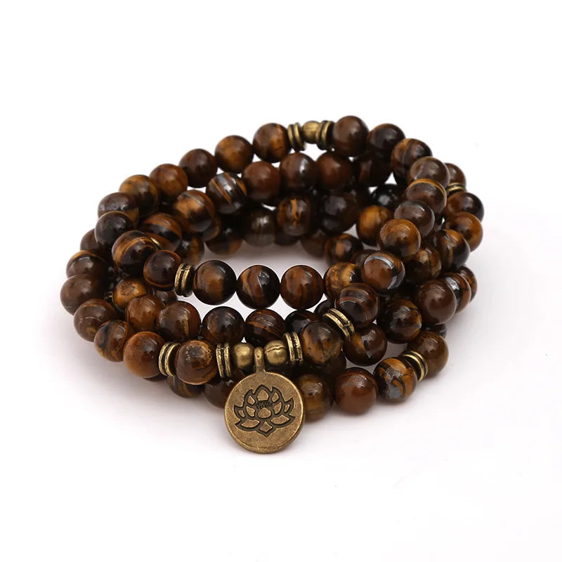 Tiger’s Eye multi-wrap mala with charm arranged in a compact coil, alternate view.