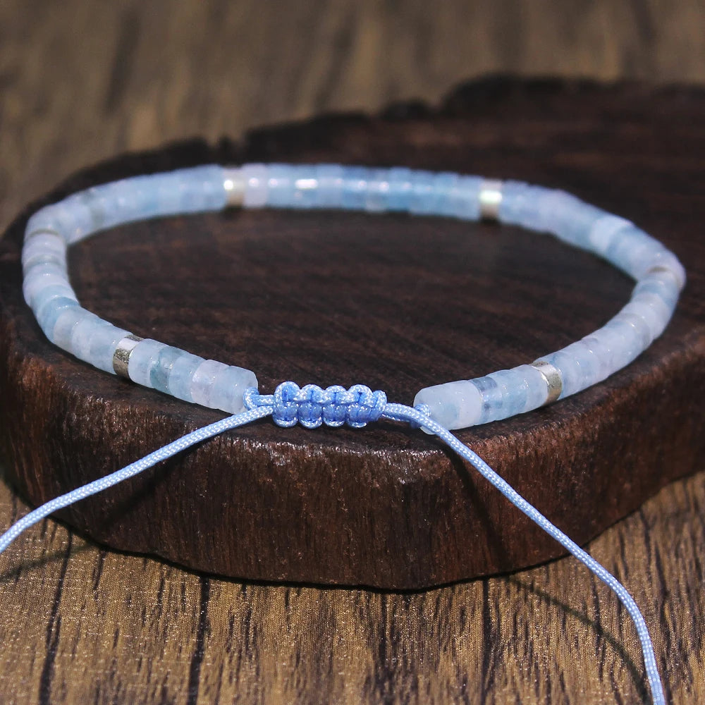 Rear view of the Aquamarine bracelet showing the blue sliding-cord closure.