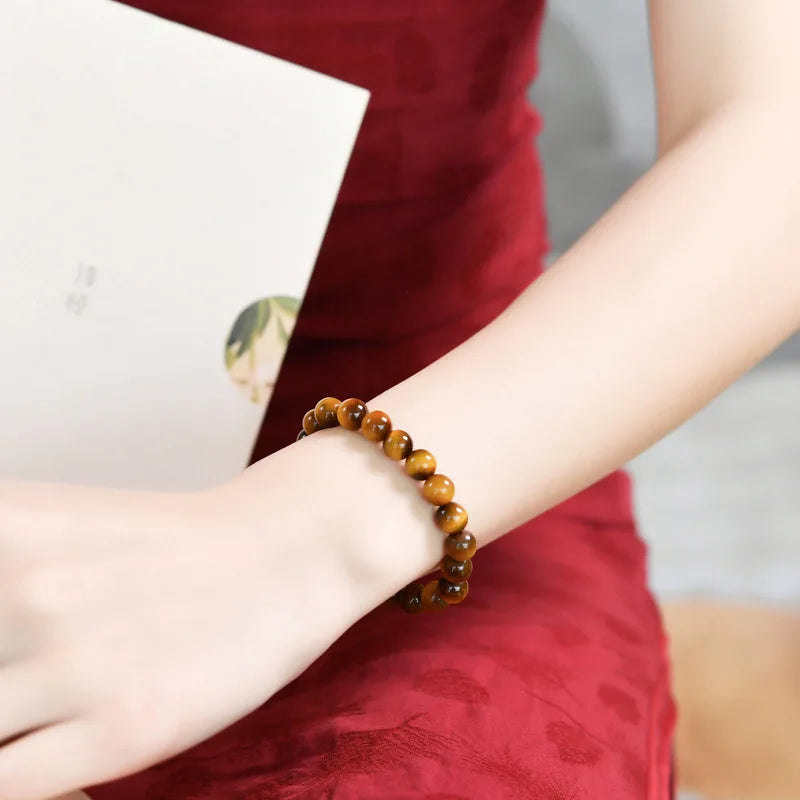 Tiger’s Eye bead bracelet worn on a wrist, alternate lifestyle view.