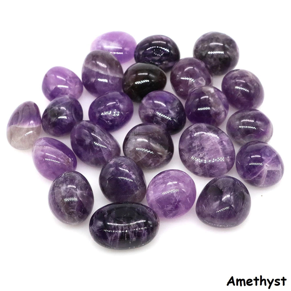 Assorted polished Amethyst tumbled stones in purple and violet tones on a white background.