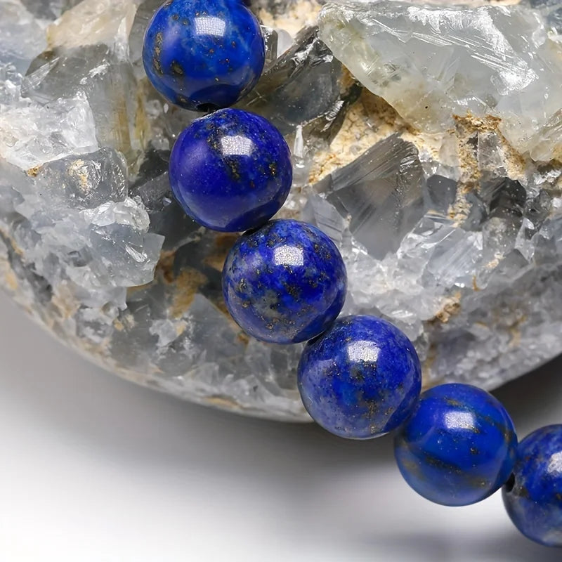 Close-up of Lapis Lazuli bracelet beads showing deep blue color and natural gold-toned flecks.
