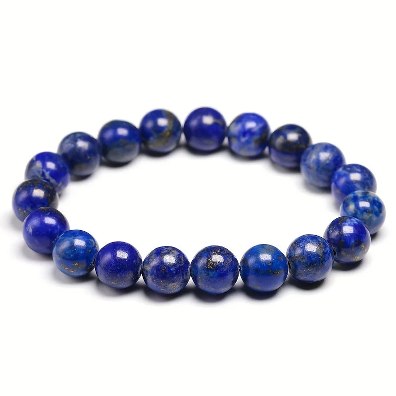Lapis Lazuli bracelet with larger round beads isolated on white.