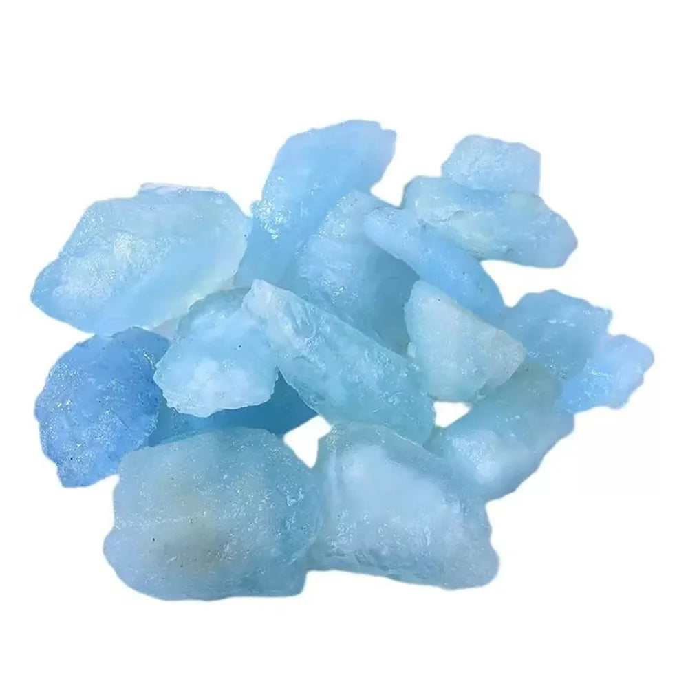 Assorted rough Aquamarine stones isolated on a white background.