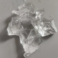 Close-up of rough transparent Clear Quartz chunks showing natural fractured surfaces.