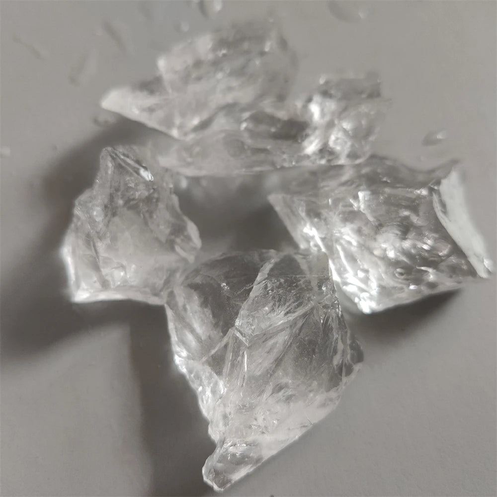 Close-up of rough transparent Clear Quartz chunks showing natural fractured surfaces.