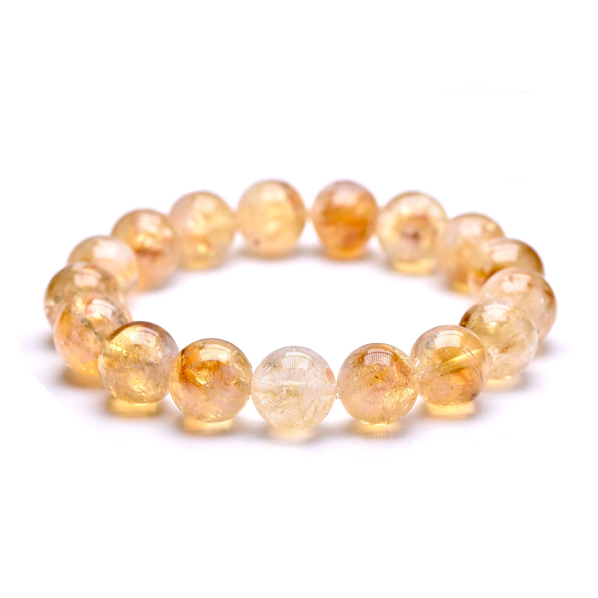 Citrine bead bracelet shown from a low angle on a white background.
