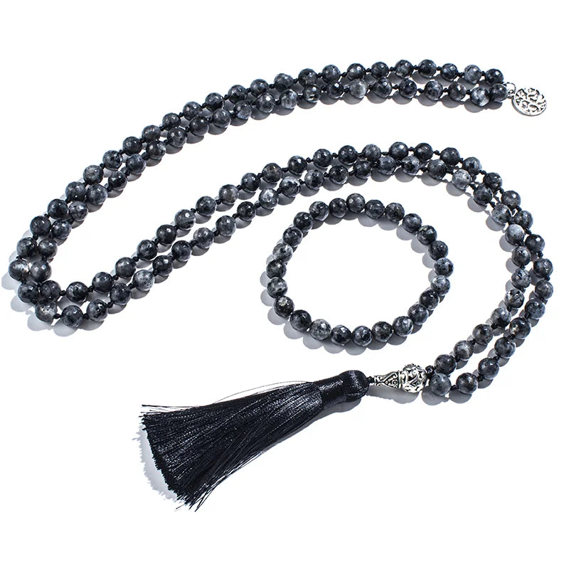 Full Labradorite mala and matching bracelet arranged on white with black tassel.