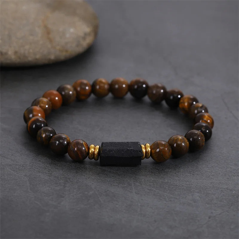 Bracelet style shown with brown striped beads and a black rectangular center stone.