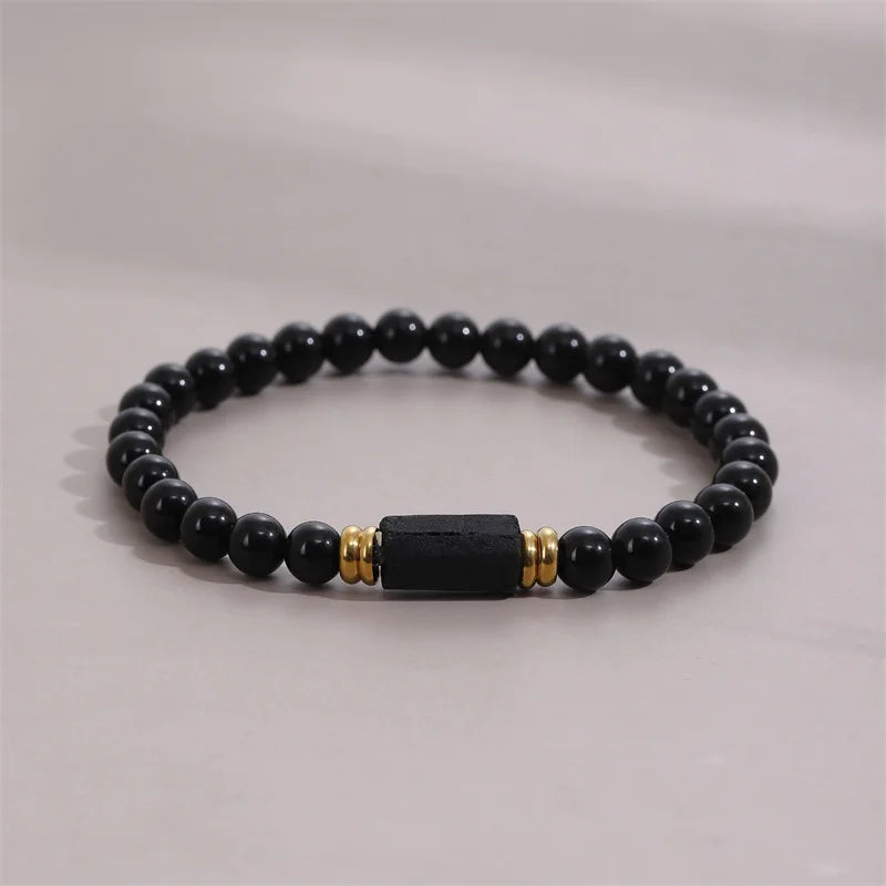 Black bead bracelet with rectangular Black Tourmaline center stone on a neutral background.