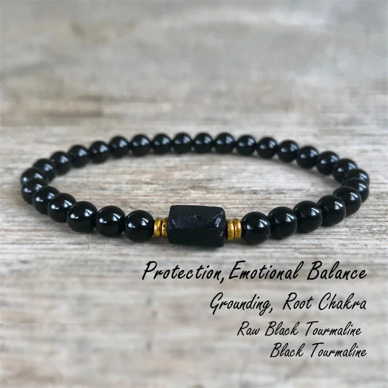 Black Tourmaline bead bracelet displayed on a rustic product card with printed crystal notes.